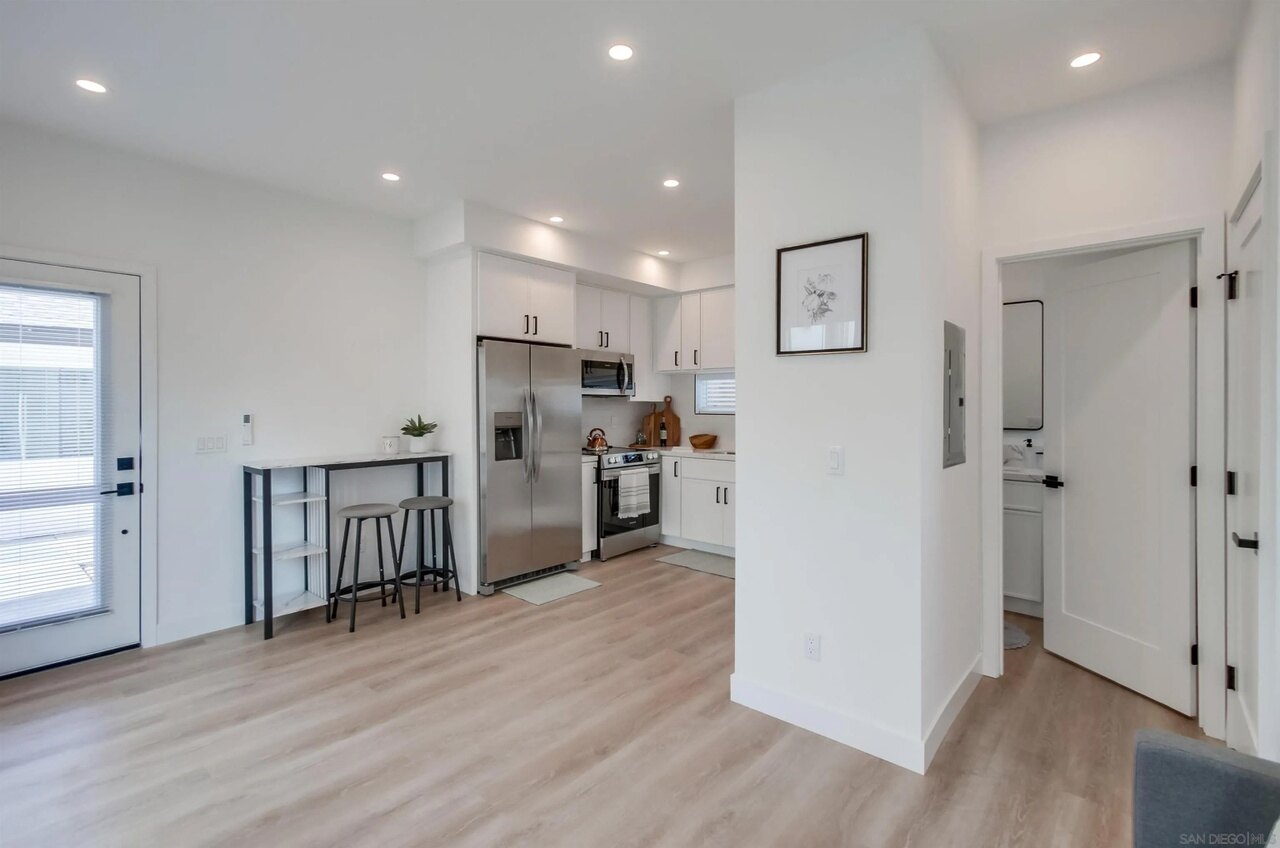 Bright finished living area and kitchen at 63rd Street