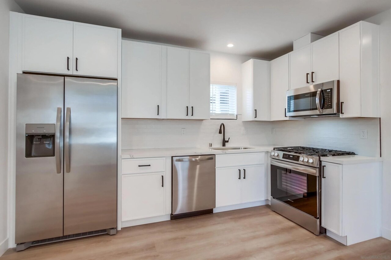 Completed white kitchen at the 63rd Street project