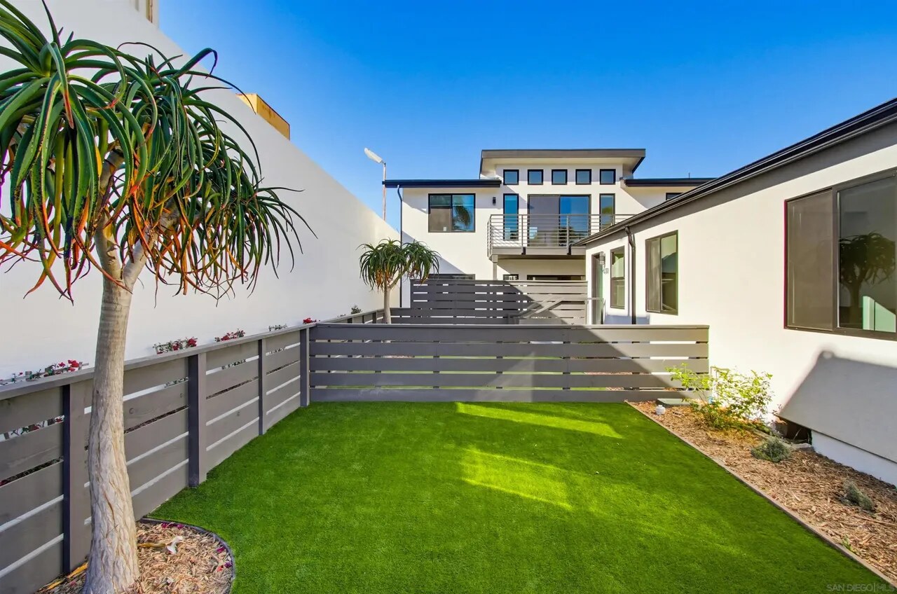 All four completed homes and shared outdoor spaces at the Felton Street project