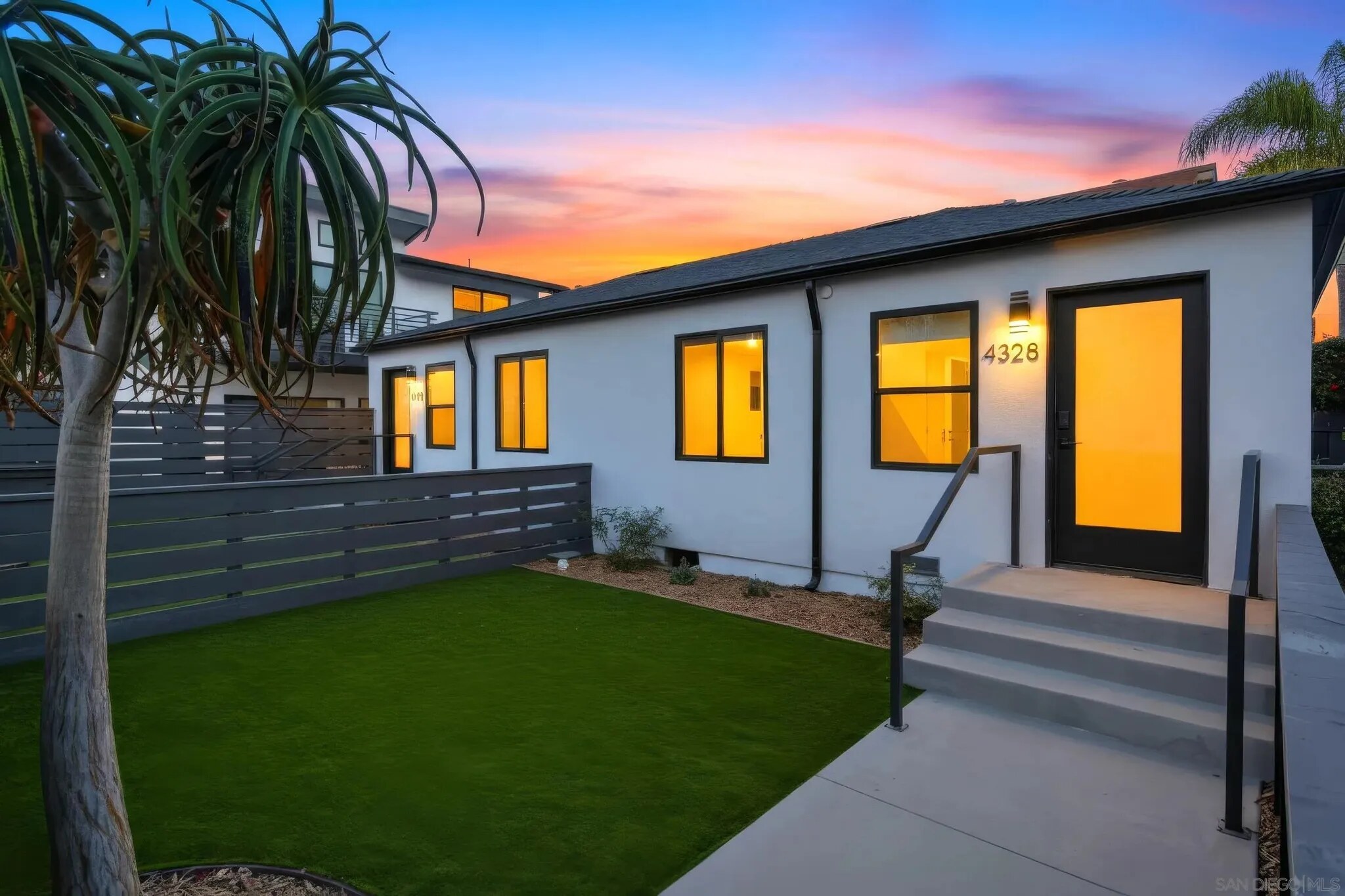 Renovated front duplex at dusk at the Felton Street project