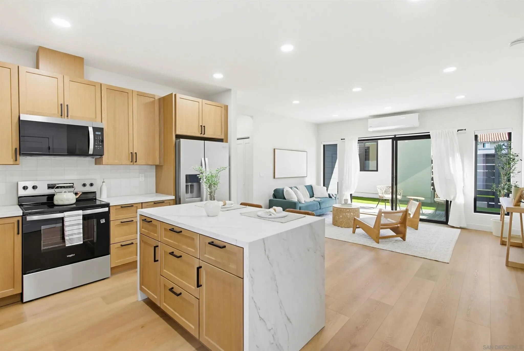 Kitchen opening to the living area inside a Felton Street home