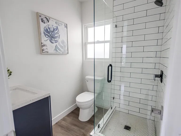 Finished bathroom with glass shower at Utah Street