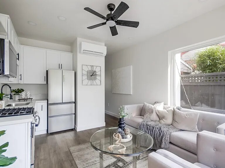 Staged kitchen and living area inside a Utah Street residence