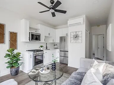 Staged living area and kitchen inside a Utah Street residence