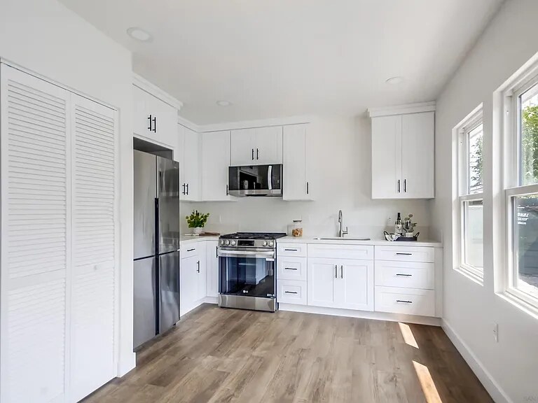 Renovated white kitchen inside a Utah Street residence